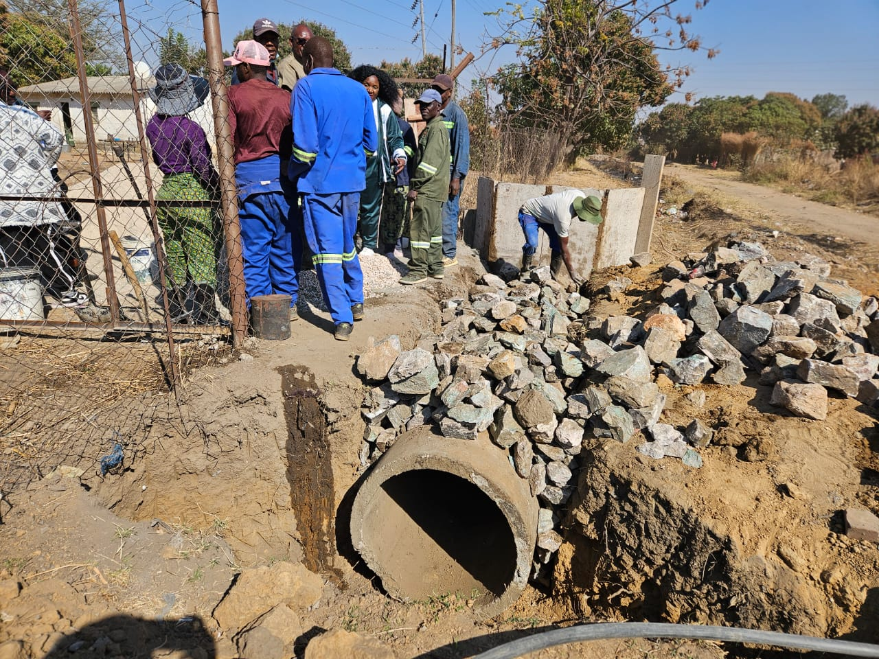 Culvert pipe, stonework and construction activity at Chebanga Primary School
